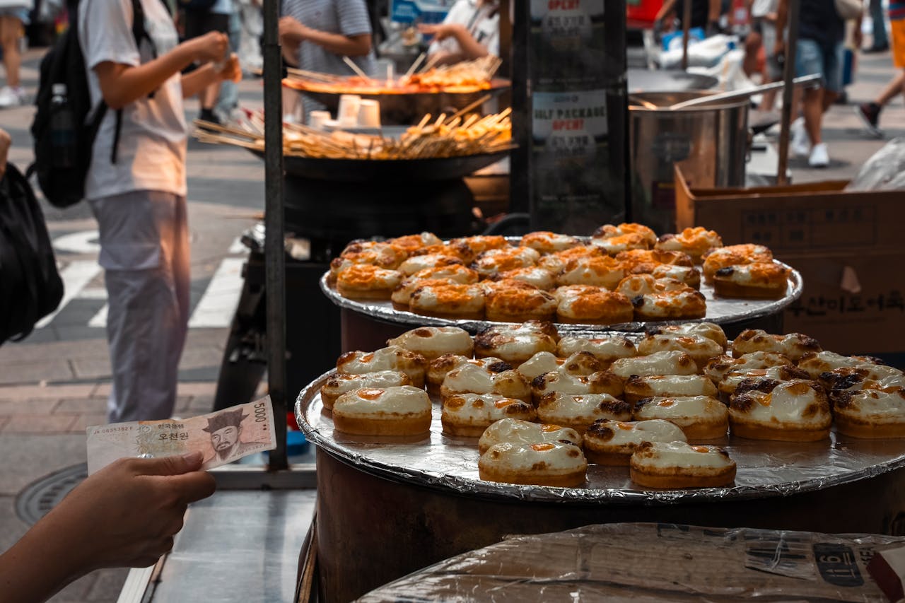 About Explore the bustling street food scene in Seoul with delicious pastries on display.